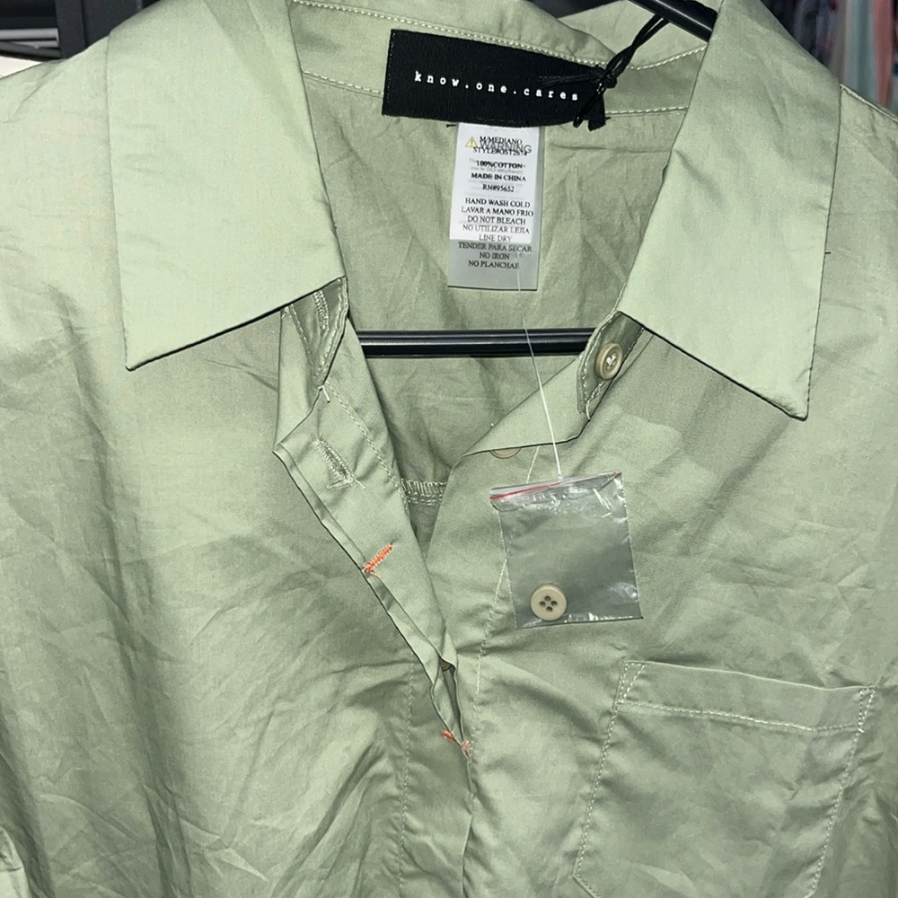 Love the color made by know one cares size medium great addition to wardrobe